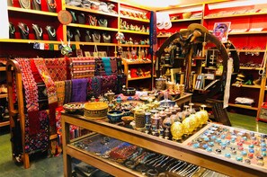 A jewelry store with shelves of necklaces, bracelets, and other accessories.