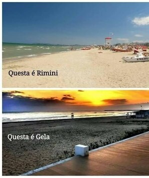 A beach scene with a lifeguard tower and a boat labeled "EMERGENCY" in Rimini. The beach is sandy with clear skies.