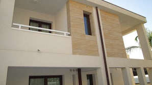 A modern two-story building with a balcony, large windows, and a flat roof. - B&B Elisir (Gela)