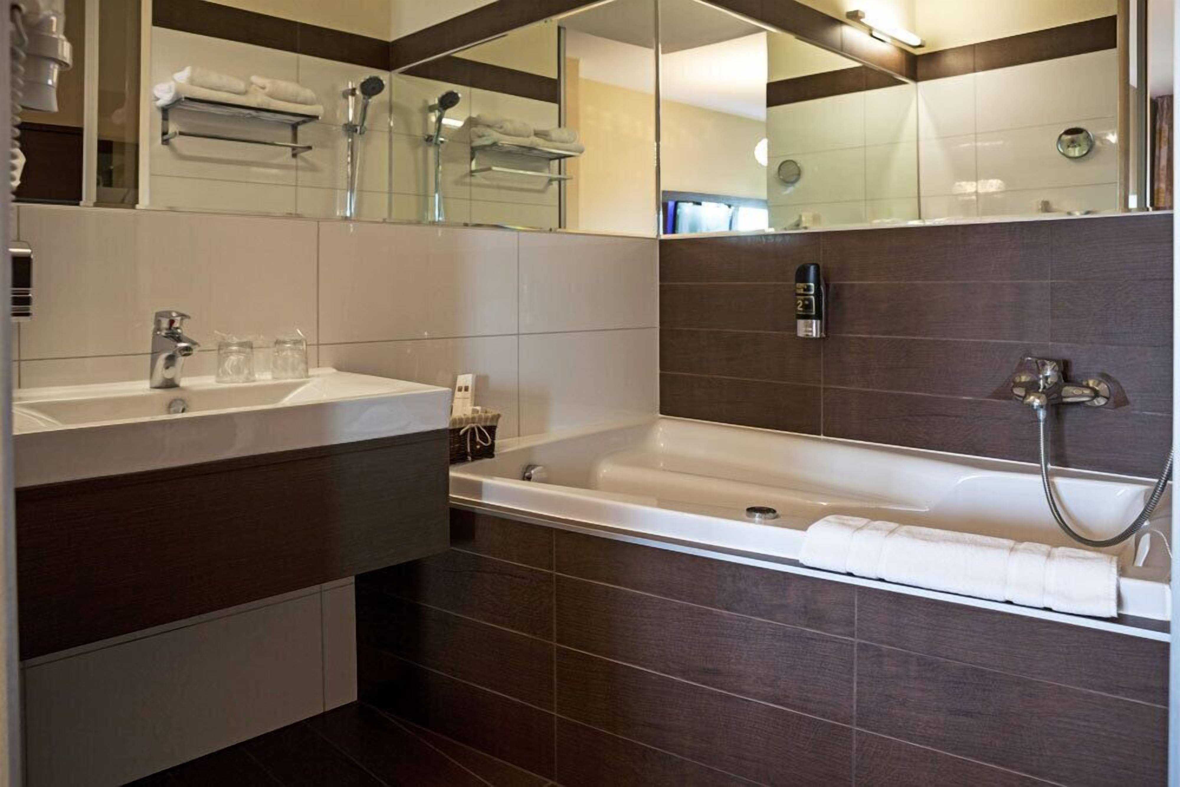 deluxe business room with terrace | bathroom | free toiletries, hair dryer, slippers, towels