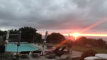 Seasonal outdoor pool, pool umbrellas, sun loungers