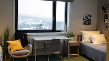 Desk, laptop workspace, blackout drapes, soundproofing