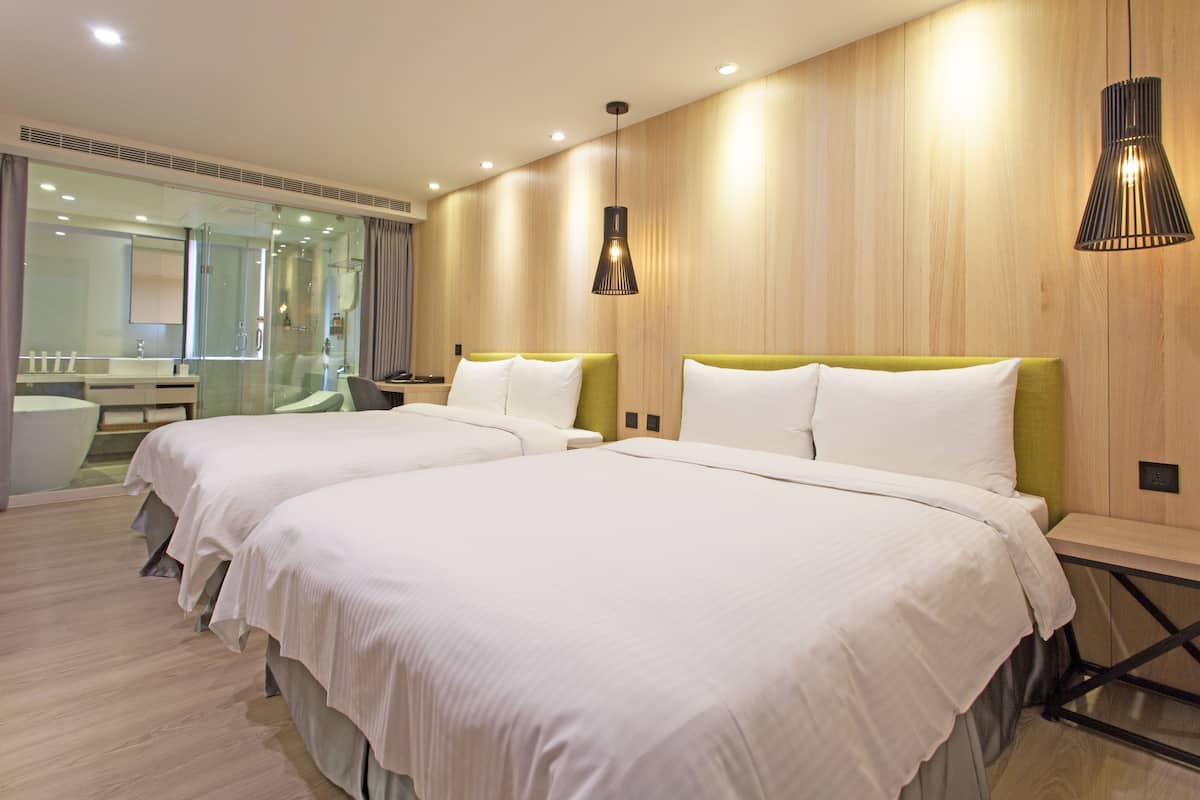 elite quadruple room | down duvets, free minibar, in-room safe, individually decorated