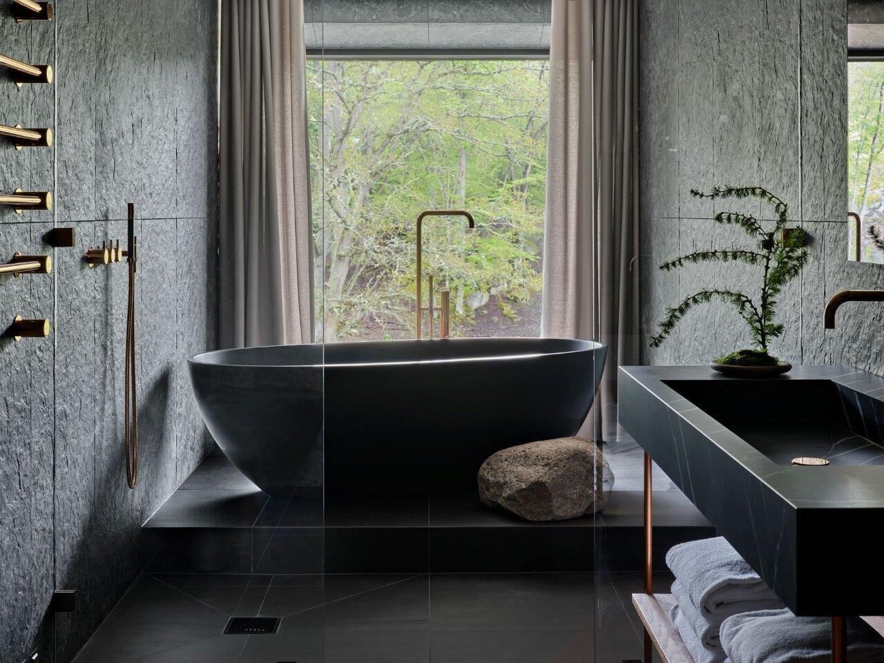 luxury suite (arken) | bathroom | hair dryer, bathrobes, slippers, towels