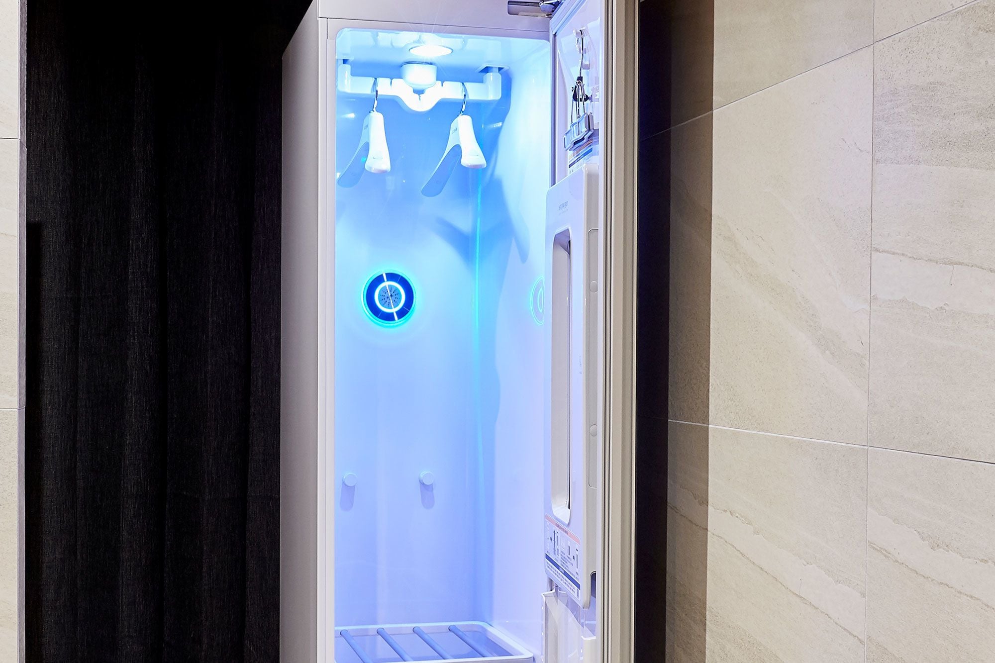 A sauna with a digital interface and a control panel.