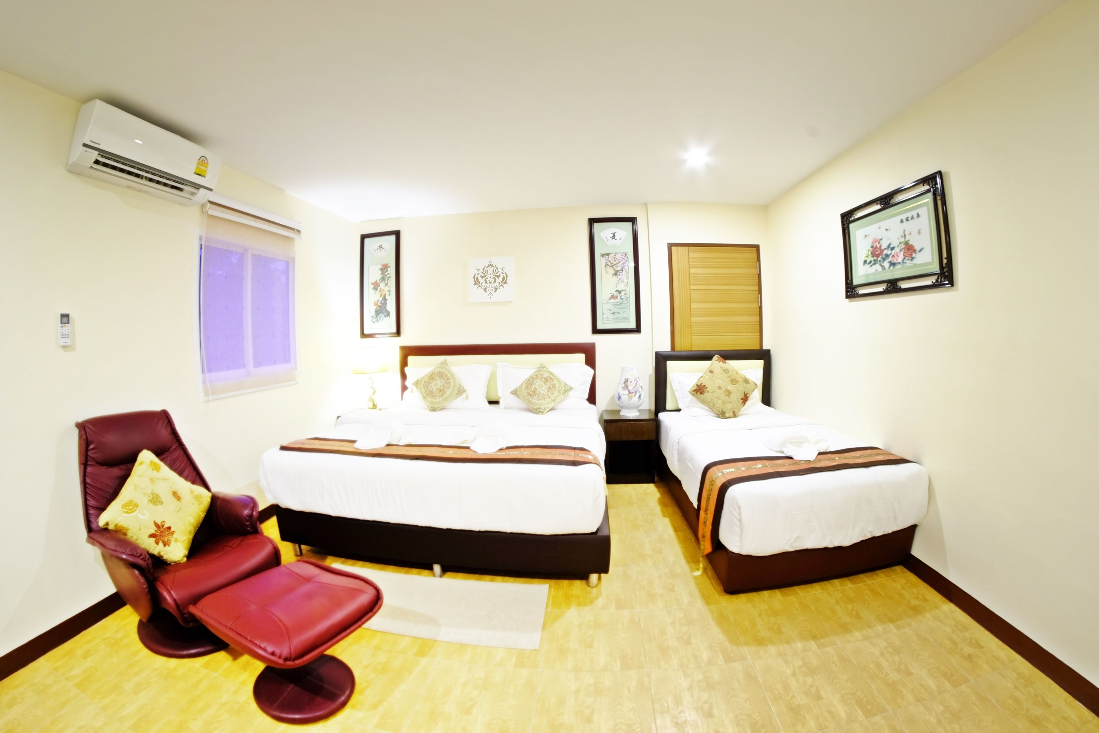 deluxe triple room, multiple beds, non smoking, refrigerator | in-room safe, desk, iron/ironing board, free wifi