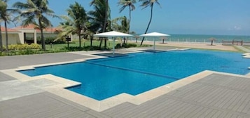 Outdoor pool, pool umbrellas, sun loungers