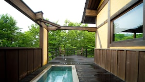 A wooden deck with a rectangular pool, wooden railings, and a view of lush greenery. - Shukubo Kawaseminoshou - The Kingfisher resort - (Taketa)