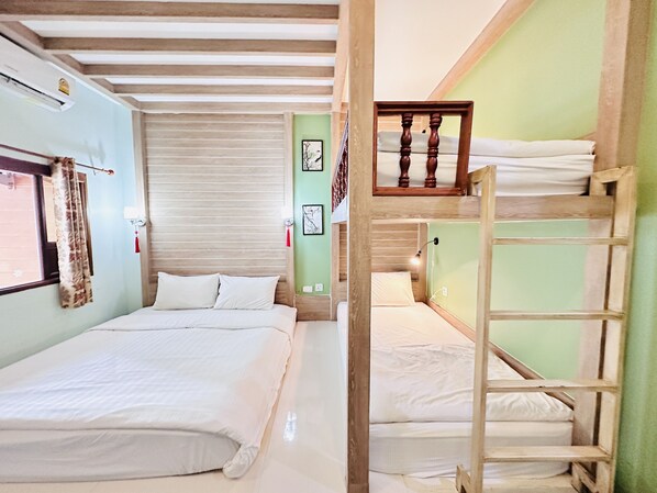 A room with two beds, a wooden ladder, a window with curtains, and a wall-mounted air conditioner. - The Luna Hostel (Sa Khu)
