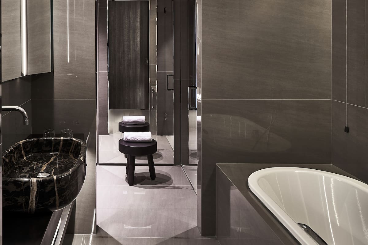 junior suite | bathroom | designer toiletries, hair dryer, bathrobes, slippers