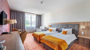 Superior tweepersoonskamer | Een minibar, een bureau, een laptopwerkplek, geluiddichte muren