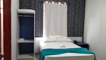 Desk, blackout drapes, iron/ironing board, rollaway beds