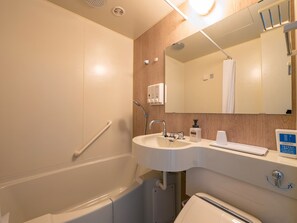 A bathroom with a white sink, mirror, and shower. - Toyoko Inn Nishi-kawaguchi-eki (Kawaguchi)