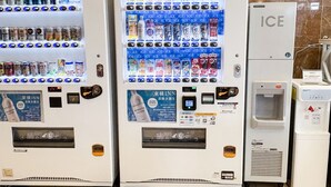 Three vending machines with various beverages and snacks, and a refrigerator labeled "ICE" next to them. - Toyoko Inn Kokura Station Minami (Kitakyushu)
