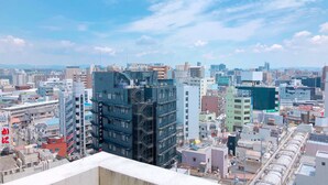 A cityscape with a variety of building styles, including modern and traditional architecture. - Toyoko Inn Osaka Hankyu Juso Station Nishi (Osaka)