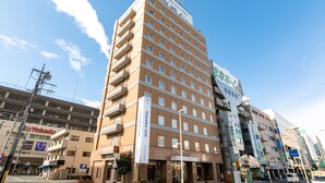 A multi-story hotel with a prominent sign for Toyoko Inn. - Toyoko Inn Wako-shi Ekimae (Wako)