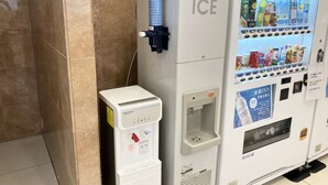 A vending machine with a water dispenser and a beverage vending area. - Toyoko Inn Matsue Ekimae (Matsue)
