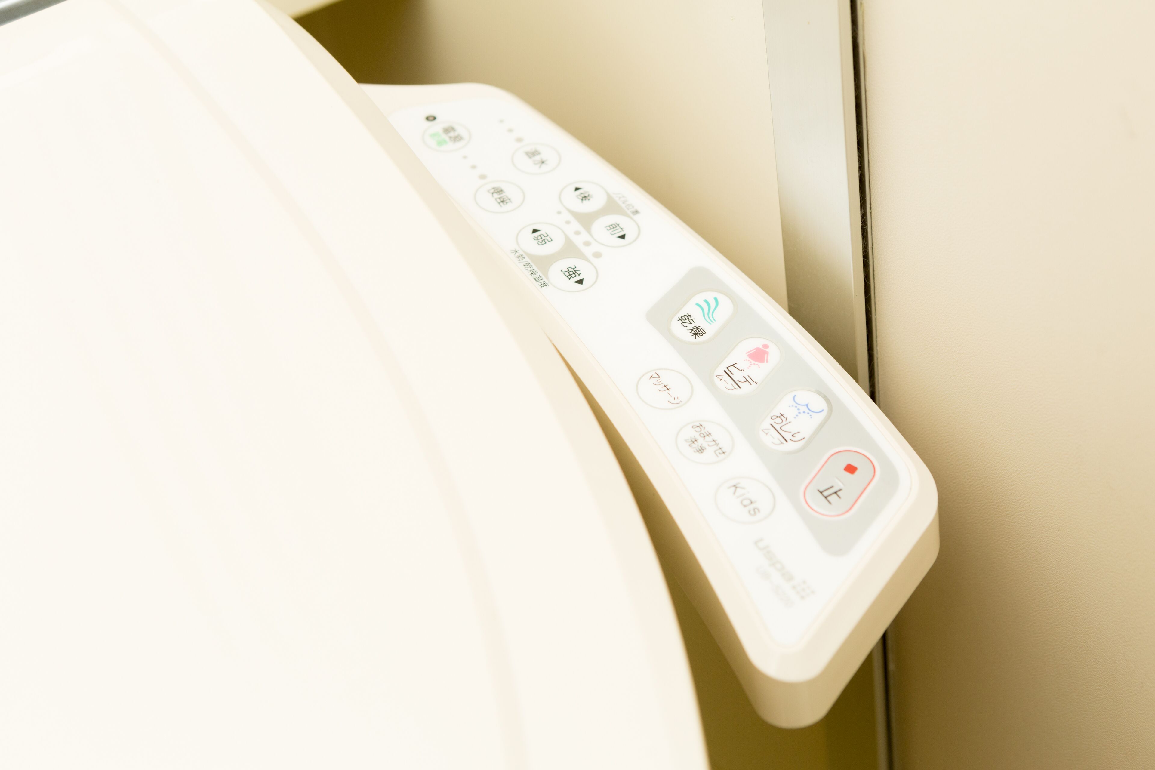 A control panel with various buttons and icons, likely for a room's amenities.