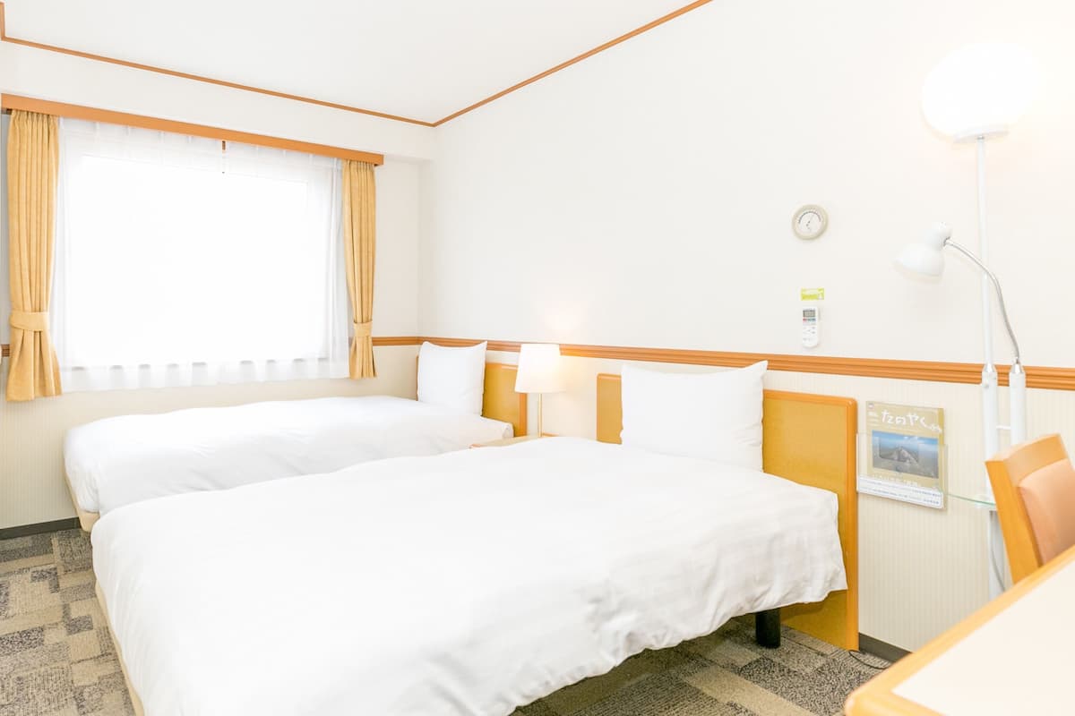 Desk, laptop workspace, blackout curtains, bed sheets