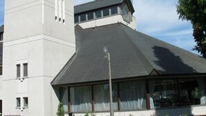 A modern building with a prominent metallic tower and a sloped roof. - Toyoko Inn Fukushima-eki Higashi-guchi No.1 (Fukushima)