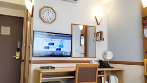 A hotel room with a desk, chair, air conditioning unit, clock, and a television displaying a map. - Toyoko Inn Fukushima-eki Higashi-guchi No.1 (Fukushima)