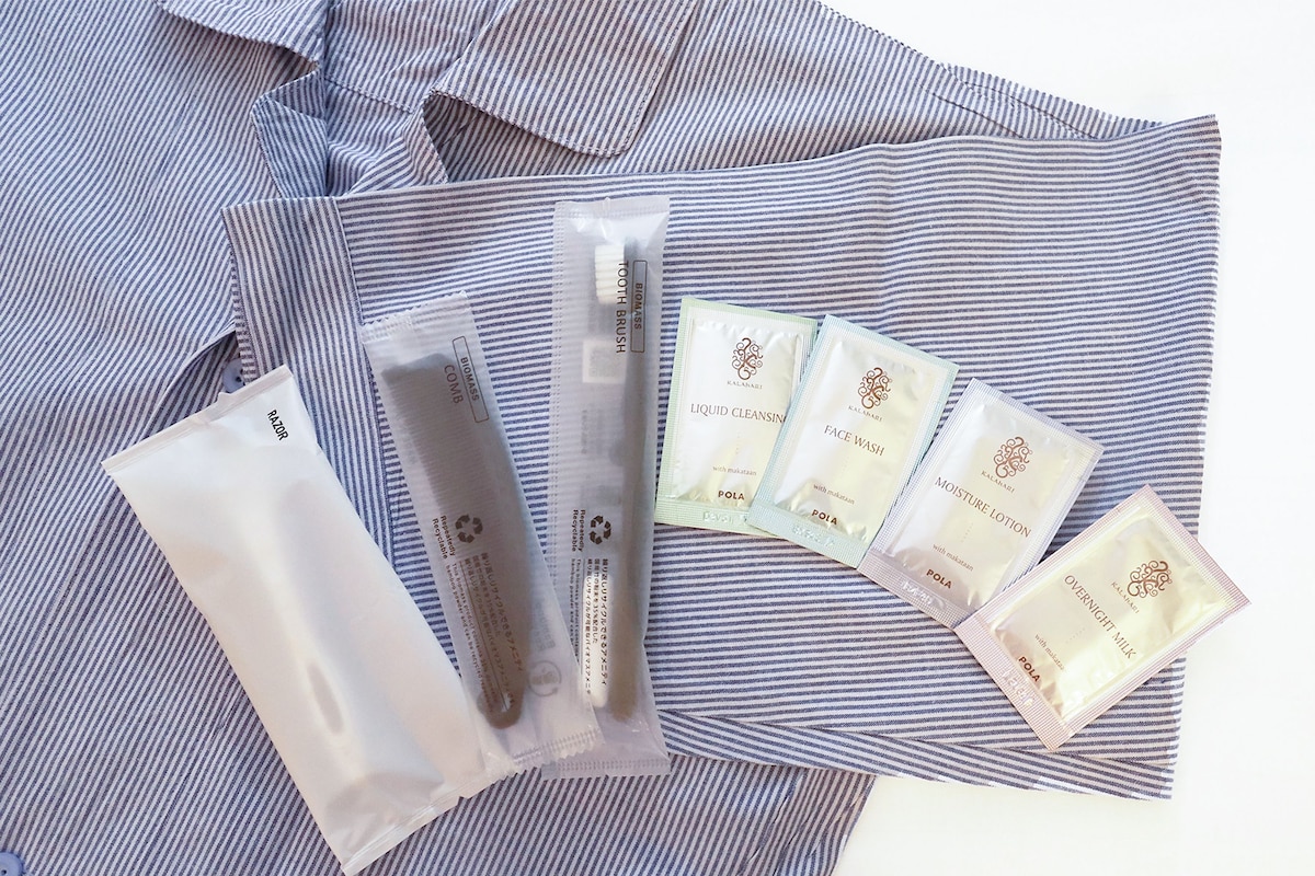 A striped fabric surface with several skincare product packages.