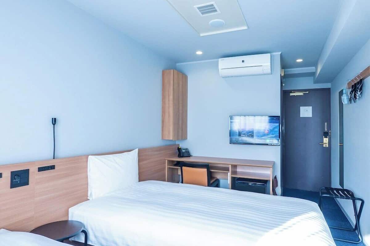 Desk, laptop workspace, free WiFi, bed sheets
