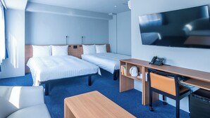 A hotel room with two beds, a desk, a chair, a TV, and an air conditioning unit. - Toyoko Inn Nagasaki Ekimae (Nagasaki)