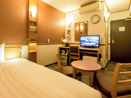 Down comforters, desk, laptop workspace, blackout drapes