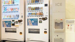 Vending machines with beverages and water dispensers in a public setting. - Toyoko Inn Shin Shirakawa Station (Nishigo)