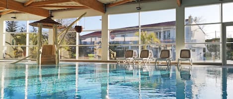 Indoor pool, open 9:00 AM to 8:00 PM, pool loungers