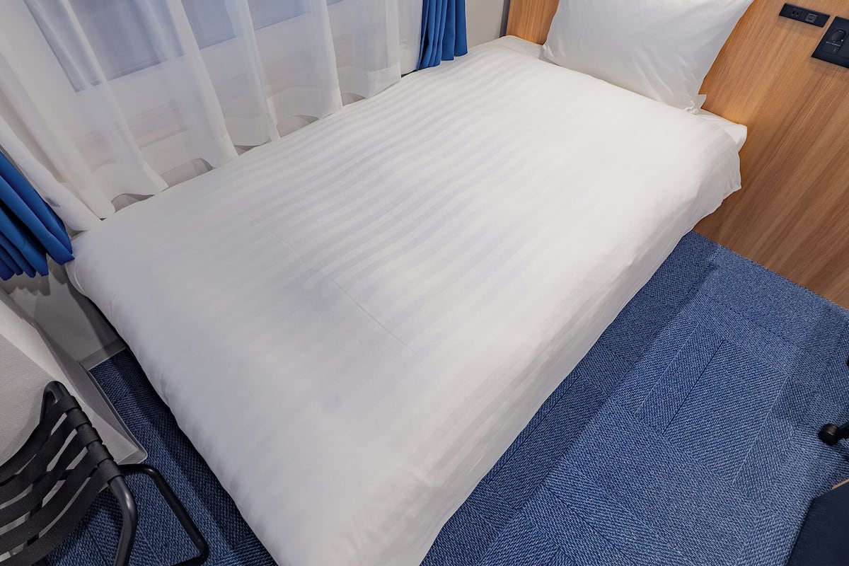 Down duvets, desk, blackout curtains, iron/ironing board