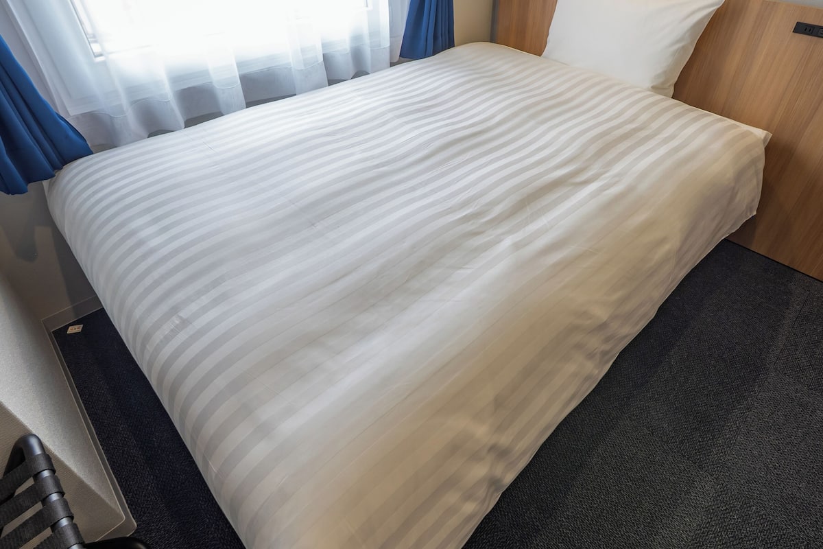Down duvets, desk, blackout curtains, iron/ironing board