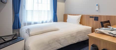 Premium Single Room, Non Smoking | Down comforters, desk, blackout drapes, iron/ironing board