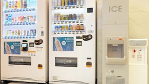 Vending machines with beverages and snacks, an ice dispenser, and a water service station. - Toyoko Inn Ise Matsusaka Ekimae (Matsusaka)