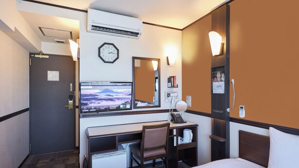 A hotel room with a bed, desk, chair, and a television displaying a landscape. - Toyoko Inn Kintetsu Nara Ekimae (Nara)