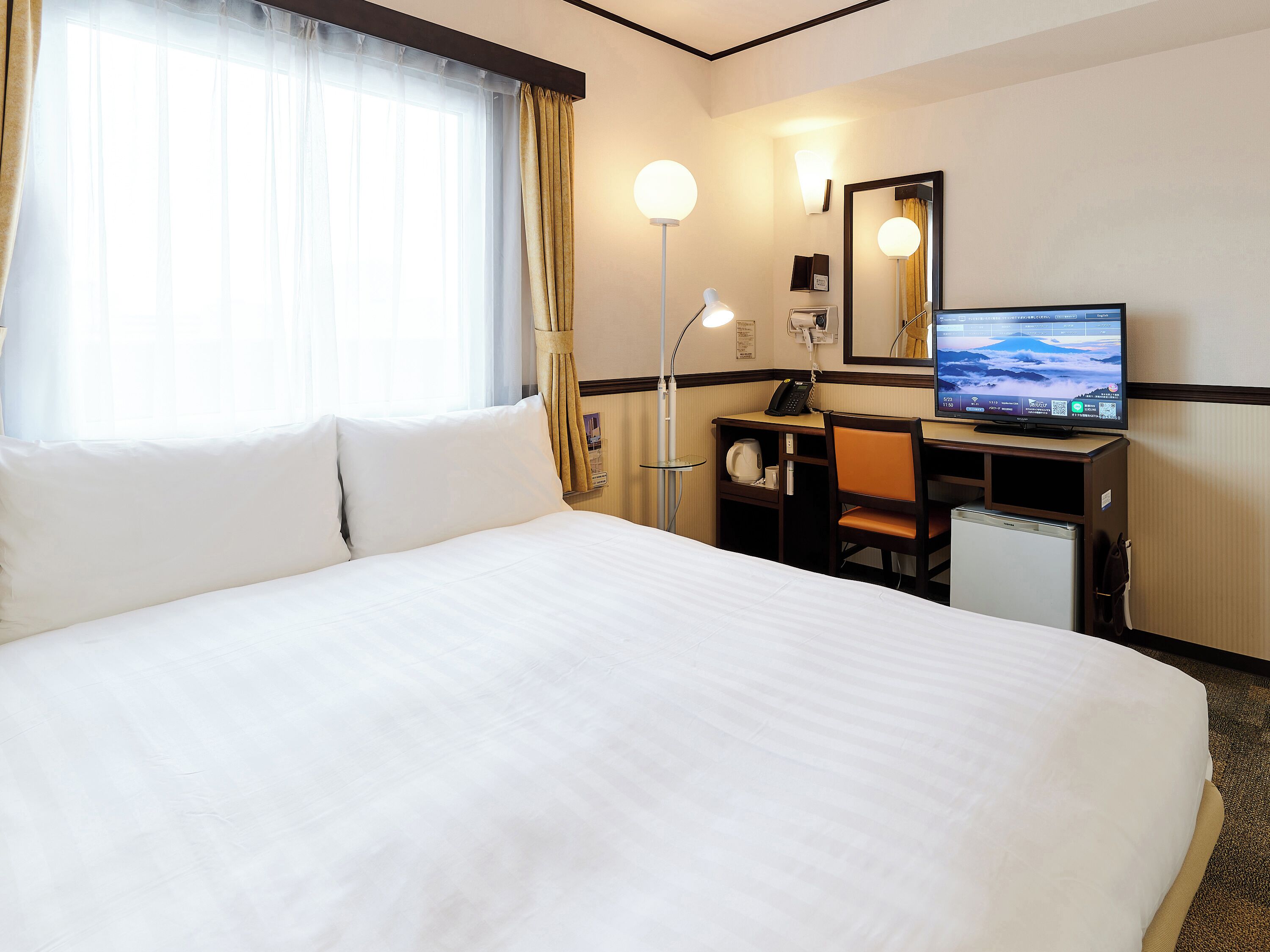 Desk, laptop workspace, free WiFi, bed sheets