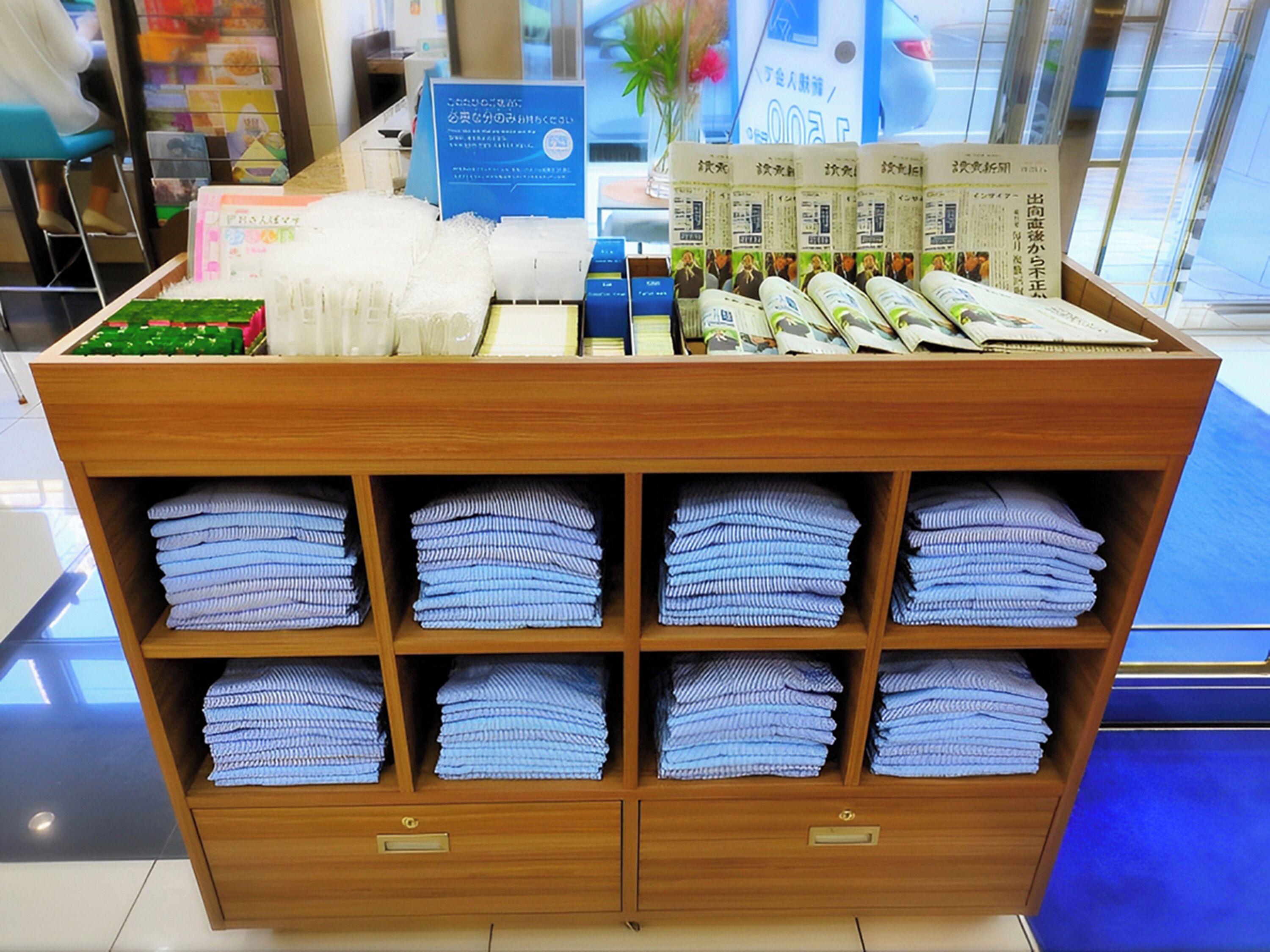 A display of neatly folded towels and toiletries in a hotel setting.