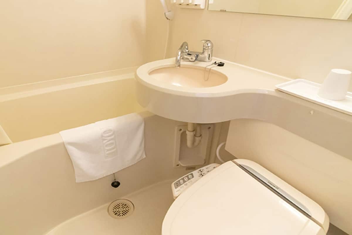 Combined shower/bathtub, slippers, electronic bidet, towels
