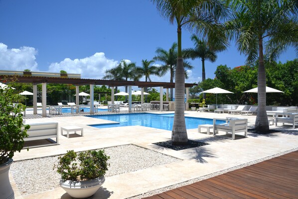 2 outdoor pools, open 8:00 AM to 10:00 PM, pool umbrellas, pool loungers