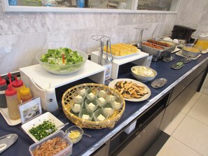 A buffet with various food items including salads, tofu, and other dishes. - Toyoko Inn Kagoshima Chuo Station Higashi (Kagoshima)
