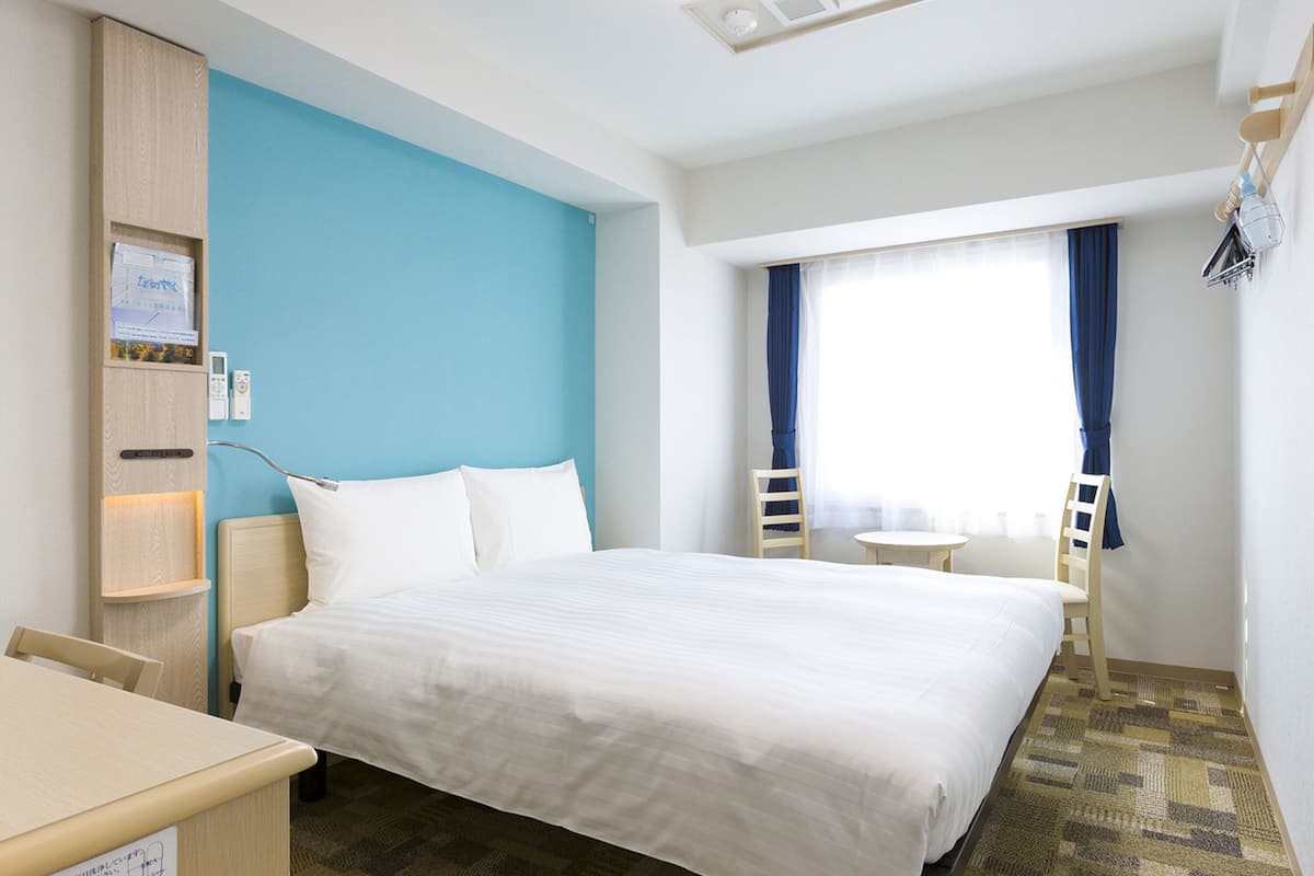 premium bedding, desk, blackout curtains, iron/ironing board