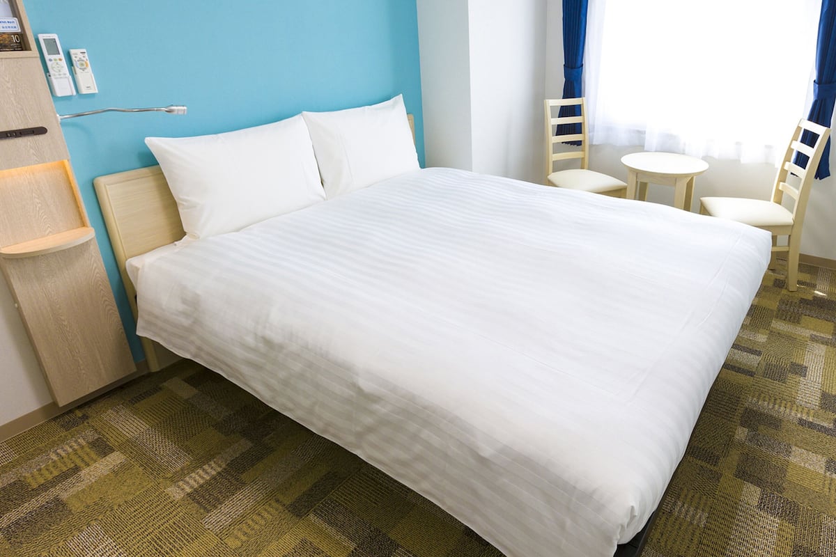 premium bedding, desk, blackout curtains, iron/ironing board