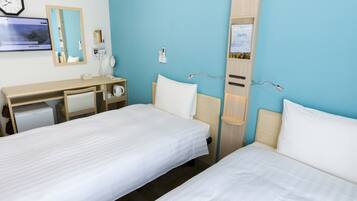 A hotel room with two beds, a desk, a mirror, a clock, and a wall-mounted TV.