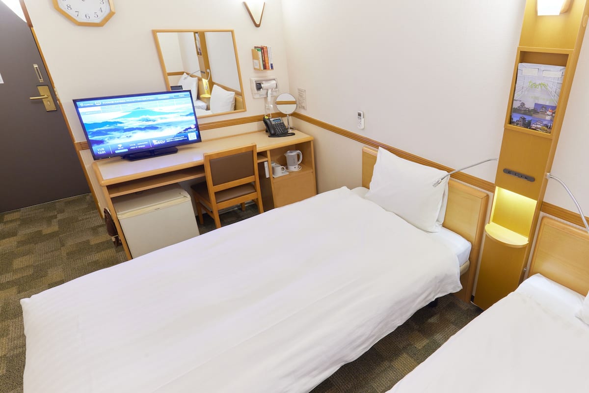 desk, laptop workspace, blackout curtains, iron/ironing board