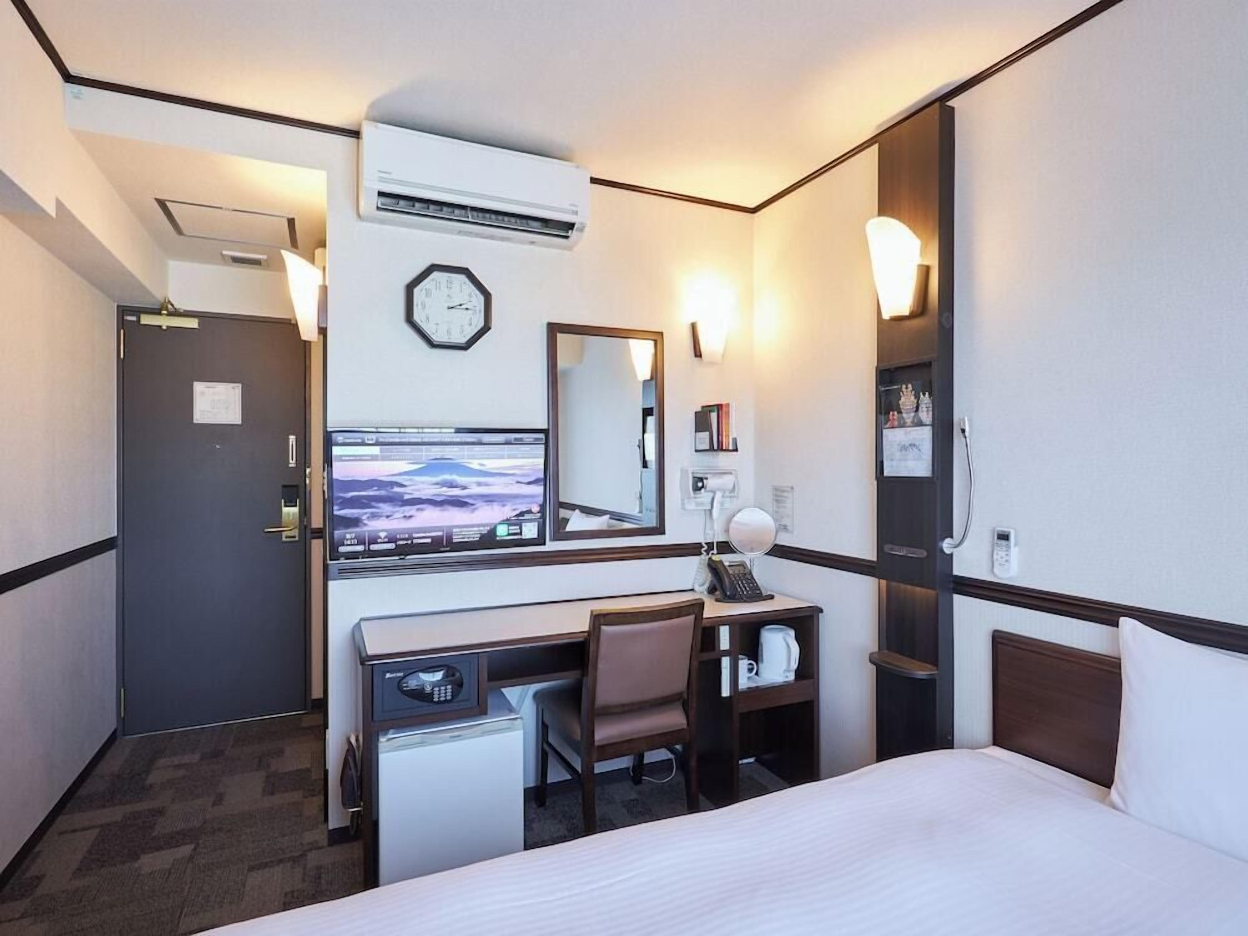 Desk, laptop workspace, blackout drapes, WiFi