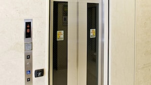 An elevator with a digital display, emergency contact button, and a wheelchair accessibility button. - Toyoko Inn Fukuoka Tenjin (Fukuoka)