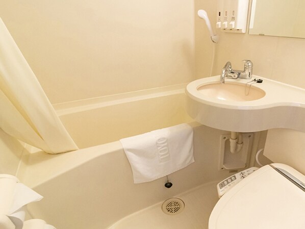 Ein Badezimmer mit einem weißen Waschbecken, einer Badewanne und einer Toilette.