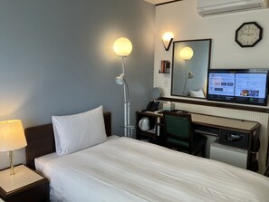 Desk, laptop workspace, bed sheets