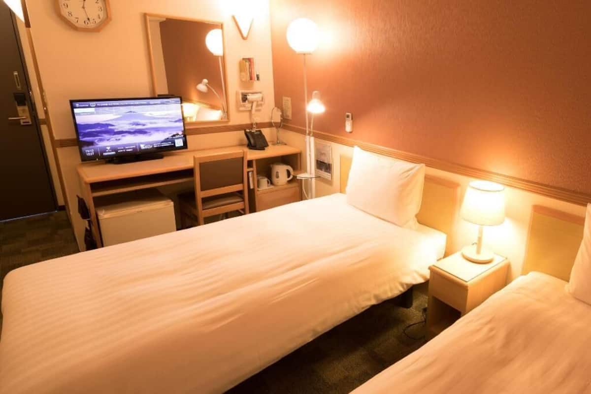 Desk, laptop workspace, free WiFi, bed sheets